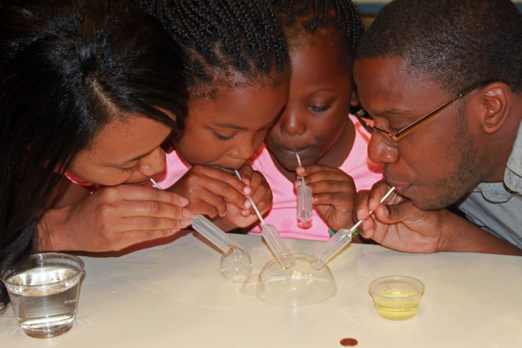 A family explores the science of bubbles